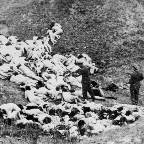 German_officer_executes_Jewish_women_who_survived_a_mass_shooting_outside_the_Mizocz_ghetto,_14_October_1942.jpg