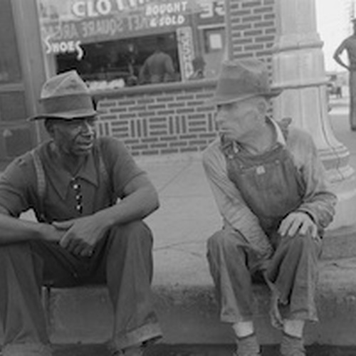 Negro and White Man Sitting on Curb.jpg
